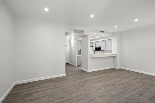 a view of kitchen with wooden floor and windows