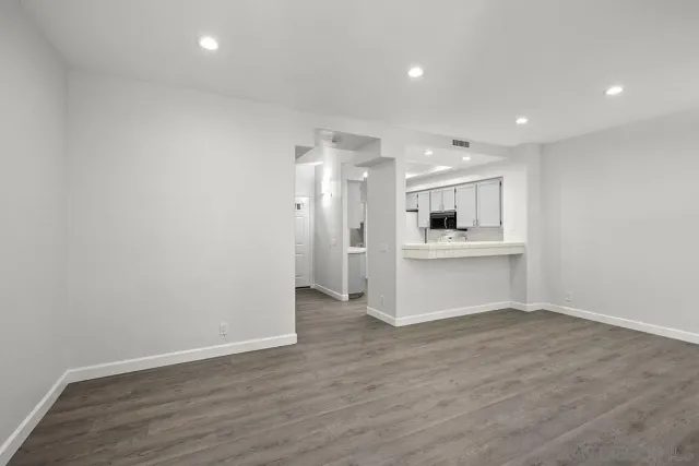 a view of kitchen with wooden floor and windows