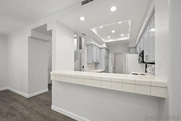 a bathroom with a sink a mirror and shower