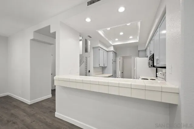 a bathroom with a sink a mirror and shower