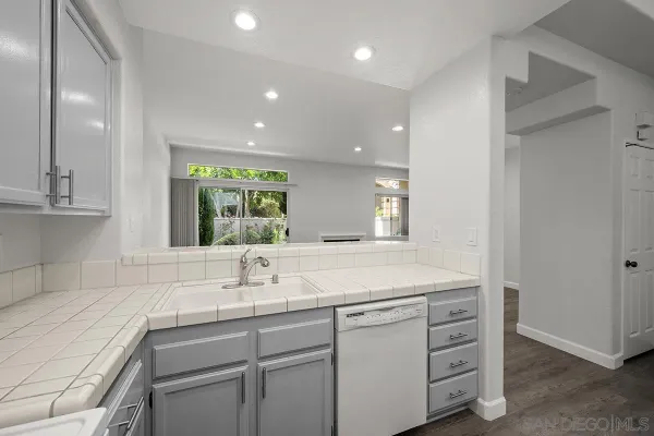 a kitchen with sink and window