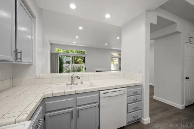 a kitchen with sink and window