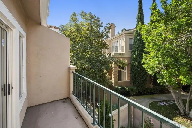 a view of a balcony with plants