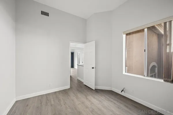 a view of an empty room and window