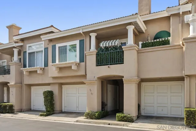 a front view of a house with garage