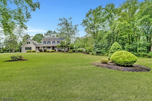 a view of an house with a big yard