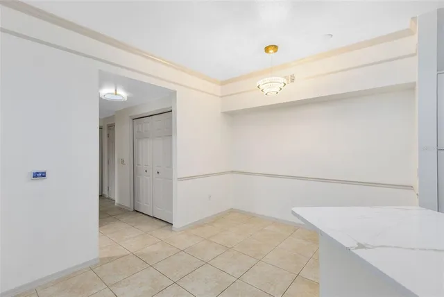 a view of storage and utility room with closet