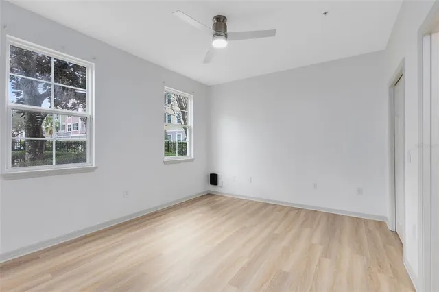 a view of an empty room with a window