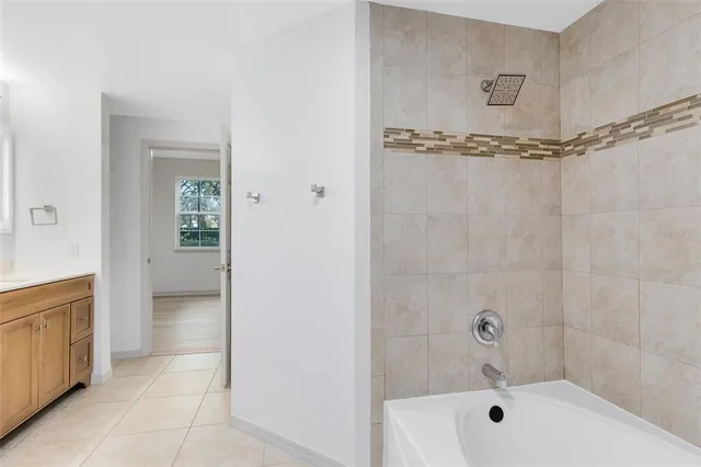 a bathroom with a bathtub and shower