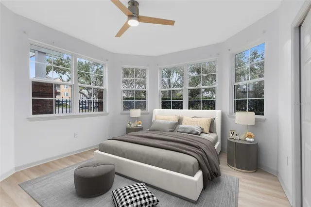 a bedroom with a bed and window