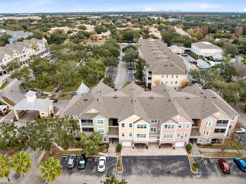 3315 Parkchester Square Boulevard, Unit 102 Orlando, FL 32835 - Photo 2 of 37 an aerial view of residential houses with outdoor space and parking