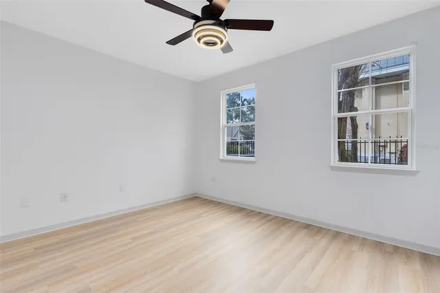 a view of a room with a wooden floor