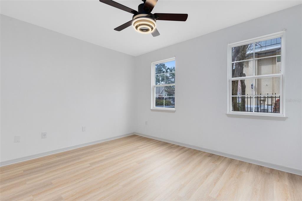 3315 Parkchester Square Boulevard, Unit 102 Orlando, FL 32835 - Photo 21 of 37 a view of a room with a wooden floor