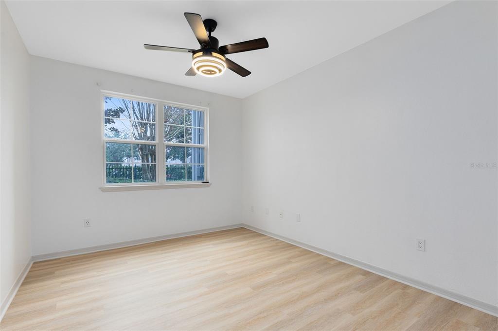3315 Parkchester Square Boulevard, Unit 102 Orlando, FL 32835 - Photo 24 of 37 an empty room with a window