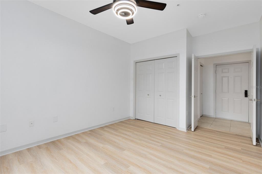 3315 Parkchester Square Boulevard, Unit 102 Orlando, FL 32835 - Photo 25 of 37 wooden floor in an empty room
