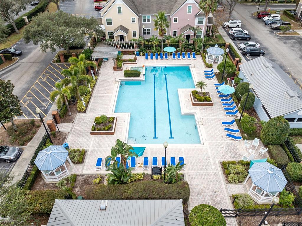 3315 Parkchester Square Boulevard, Unit 102 Orlando, FL 32835 - Photo 30 of 37 an aerial view of multiple houses with yard