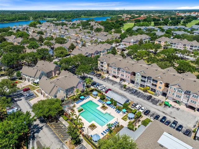 an aerial view of a house with a lake view