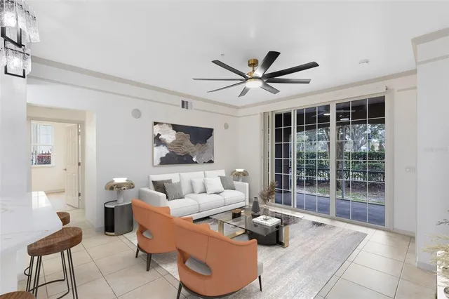 a living room with furniture and a large window