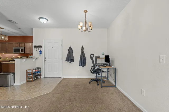 a view of a livingroom with a workspace