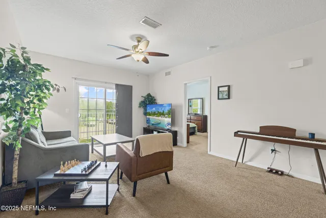 a living room with furniture and a window