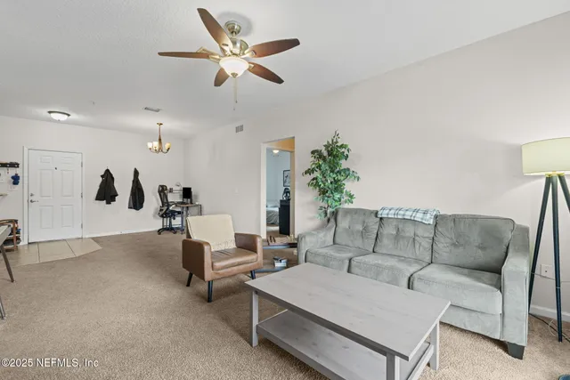 a living room with furniture and a couch