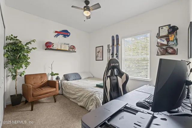 a bedroom with furniture and a window