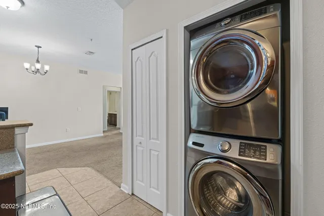 a view of a hallway with washer and dryer