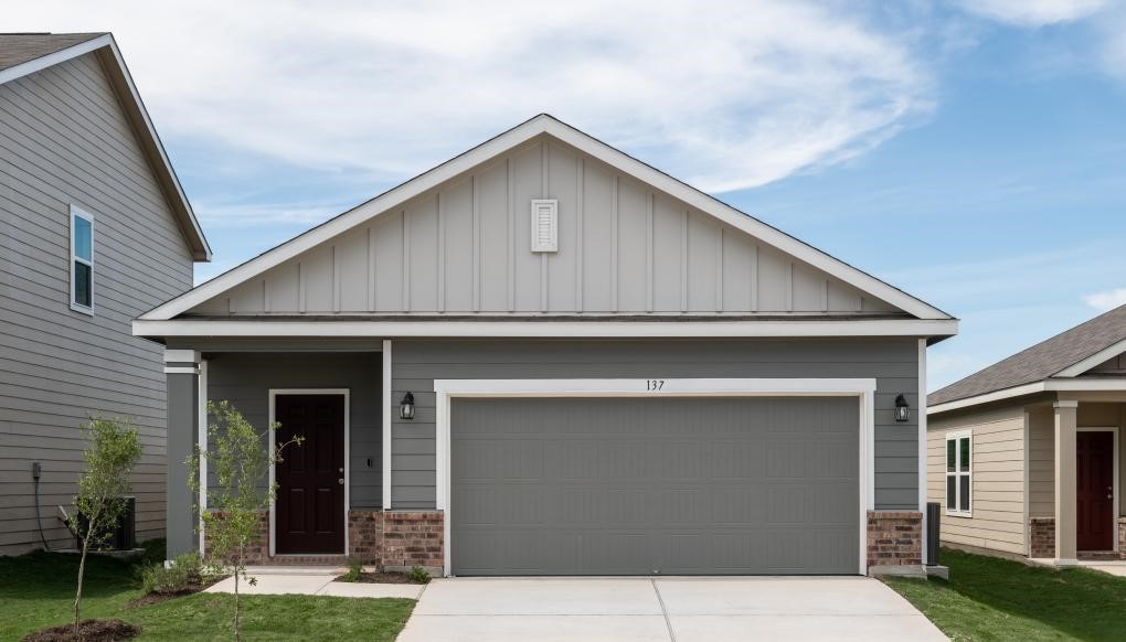 426 Line Of Fire Way Jarrell, TX 76537 - Photo 1 of 1 a front view of a house with garage