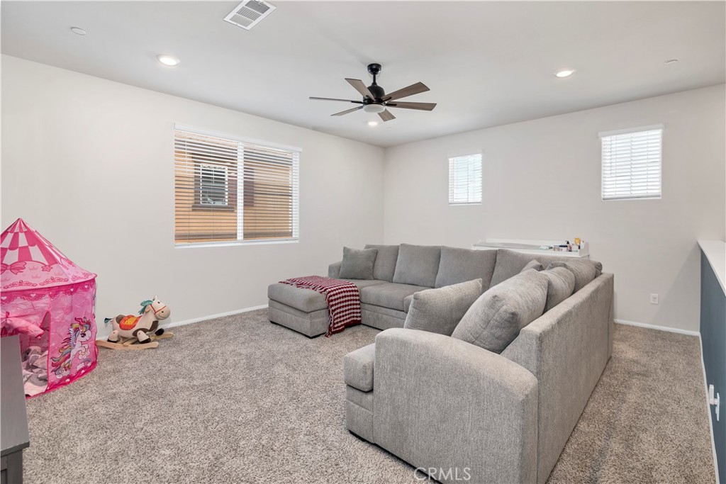32942 Forgecroft Street Menifee, CA 92584 - Photo 21 of 44 a living room with furniture