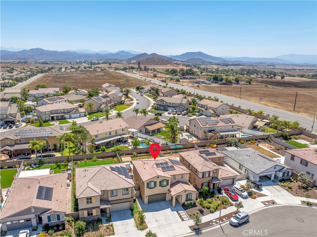 32942 Forgecroft Street Menifee, CA 92584 - Photo 41 of 44 an aerial view of residential houses with outdoor space