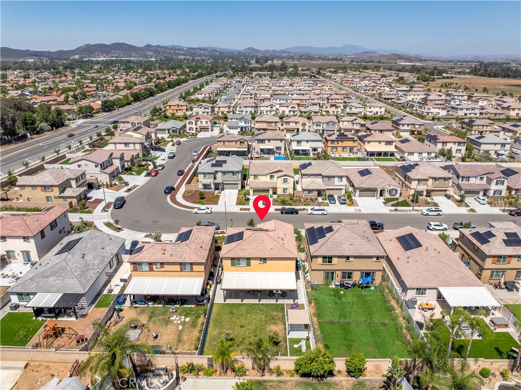 32942 Forgecroft Street Menifee, CA 92584 - Photo 43 of 44 an aerial view of residential houses with outdoor space and ocean view