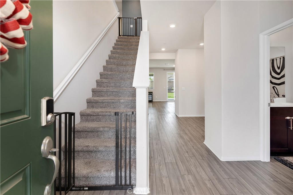 32942 Forgecroft Street Menifee, CA 92584 - Photo 5 of 44 a view of entryway and hall with wooden floor