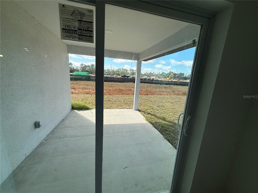 1328 Guttenburg Road North Port, FL 34288 - Photo 20 of 28 a view of a glass door with a floor to ceiling window