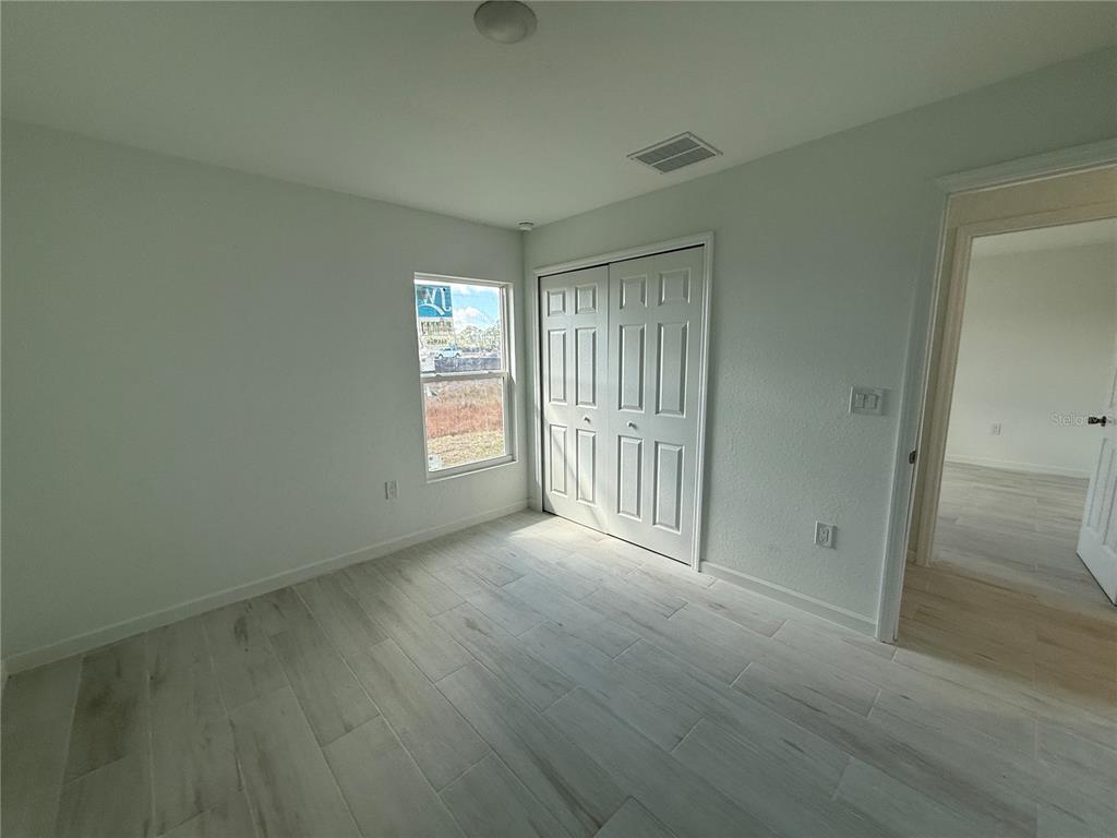 1328 Guttenburg Road North Port, FL 34288 - Photo 21 of 32 an empty room with windows