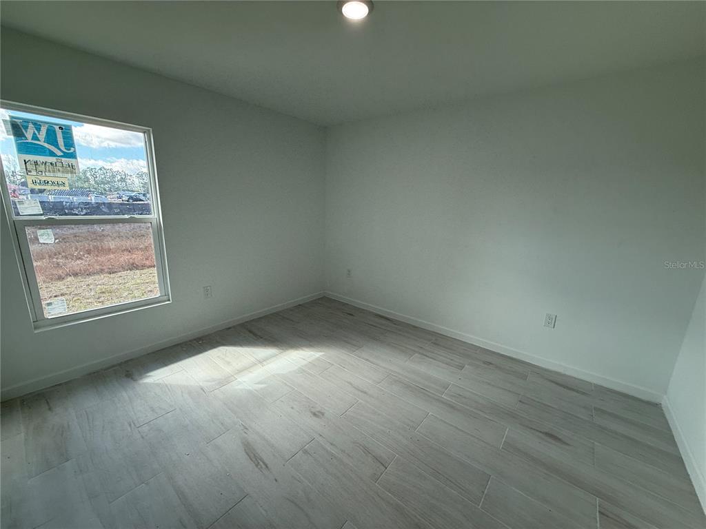 1328 Guttenburg Road North Port, FL 34288 - Photo 22 of 32 an empty room with windows