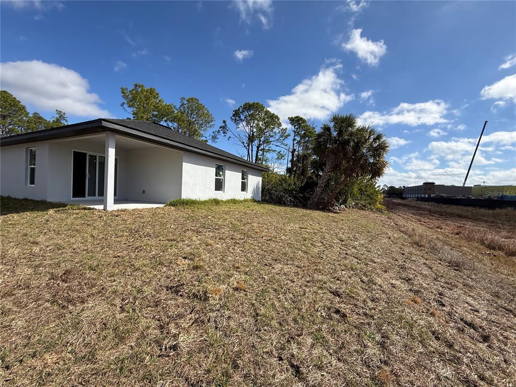 1328 Guttenburg Road North Port, FL 34288 - Photo 25 of 28 a view of a house with a yard