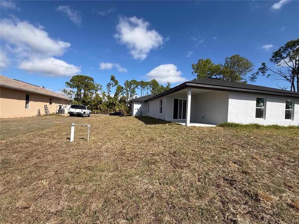 1328 Guttenburg Road North Port, FL 34288 - Photo 28 of 32 a front view of a house with a yard