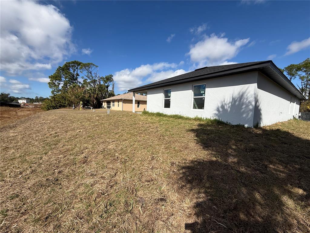 1328 Guttenburg Road North Port, FL 34288 - Photo 30 of 32 a house view with a garden space