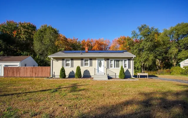 a front view of a house with a yard