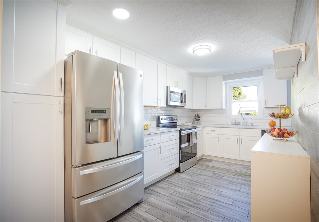 70 Gary Road Springfield, MA 01119 - Photo 3 of 20 a kitchen with a refrigerator stove and sink