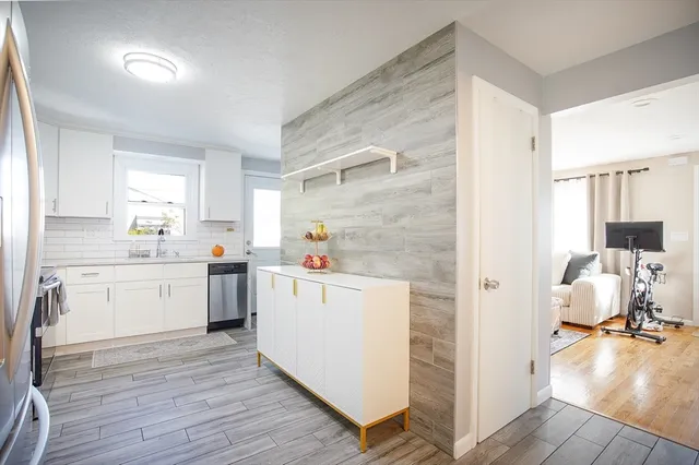 a kitchen with a sink and cabinets