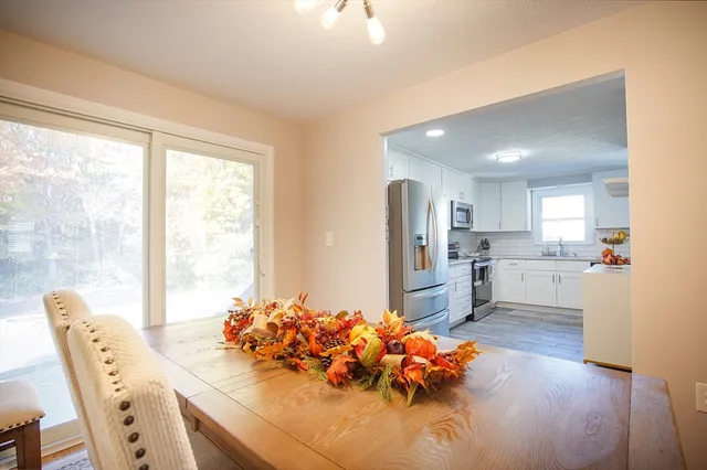 a kitchen with stainless steel appliances kitchen island granite countertop a sink and cabinets