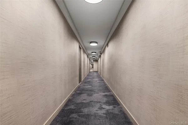 a view of a hallway with a stairs