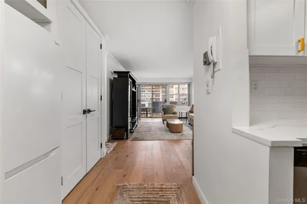a view of a hallway view with living room and dining room