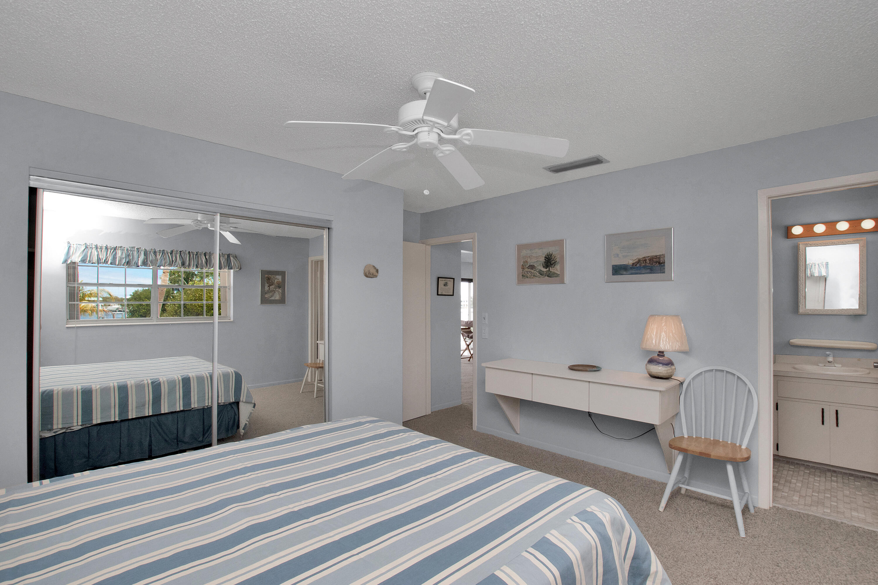 136 Brian Road Marathon, FL 33050 - Photo 13 of 19 a bedroom with a bed desk and a window