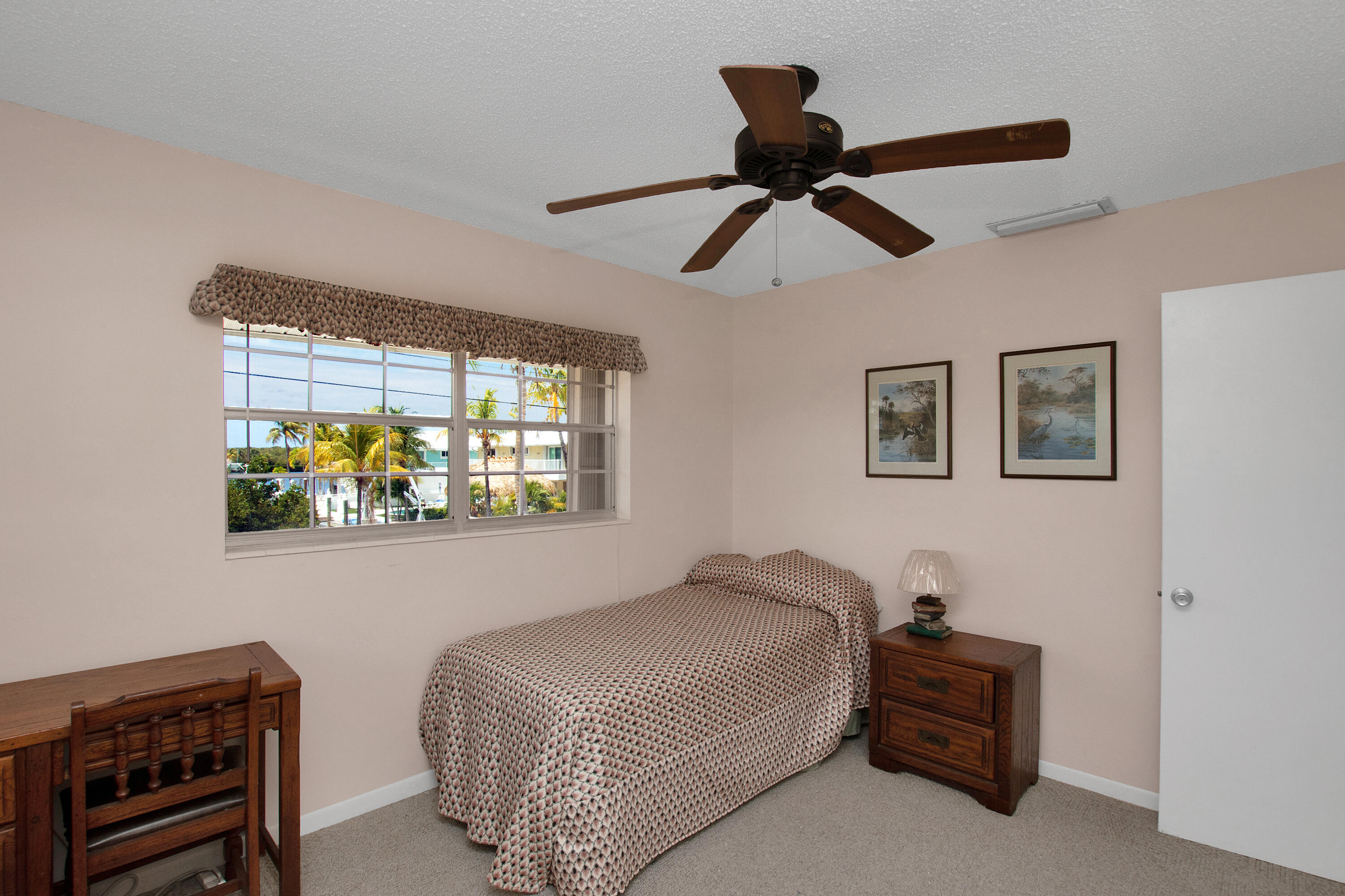 136 Brian Road Marathon, FL 33050 - Photo 16 of 19 a bedroom with a bed and a painting on the wall