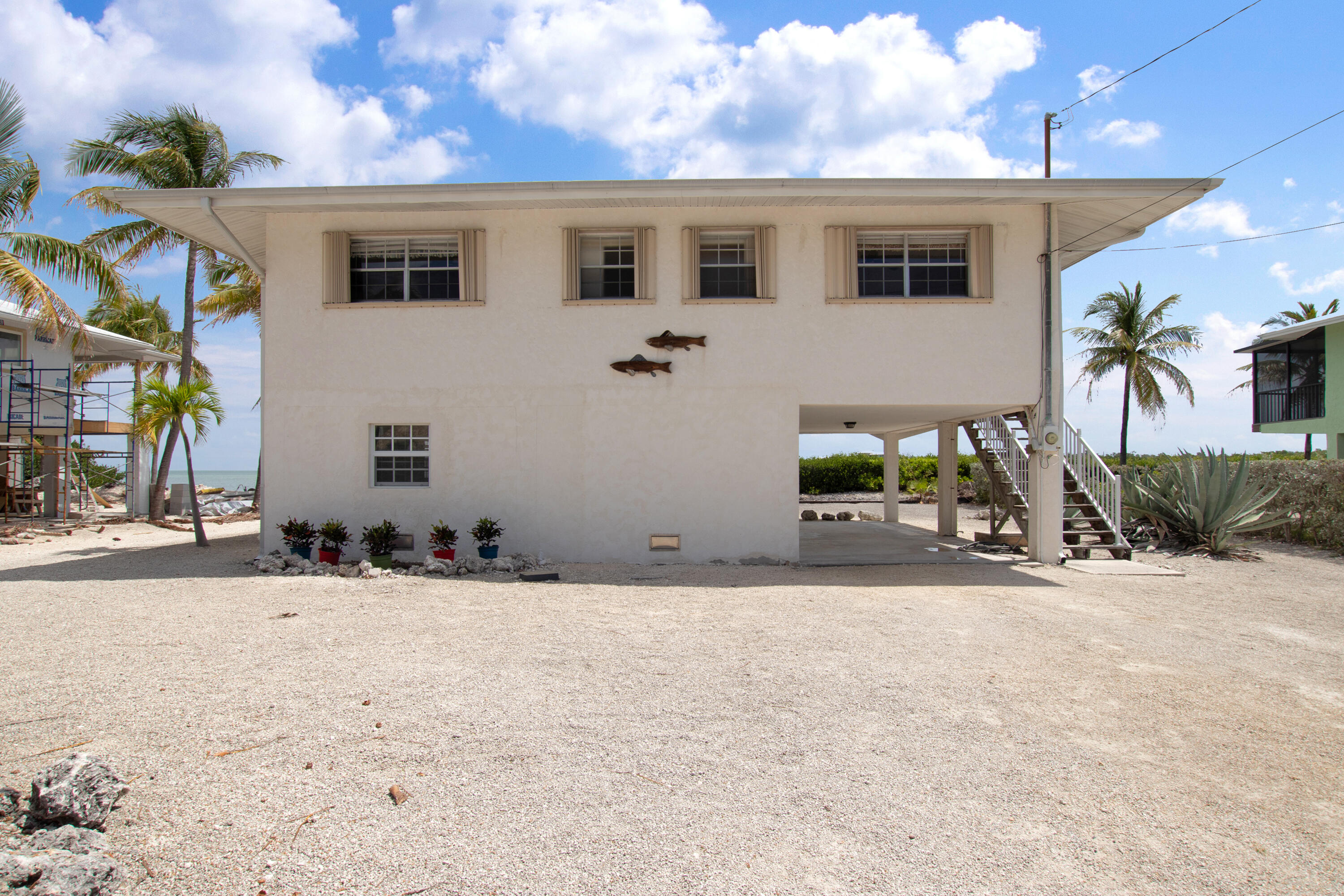 136 Brian Road Marathon, FL 33050 - Photo 6 of 19 a view of a house with a yard and garage