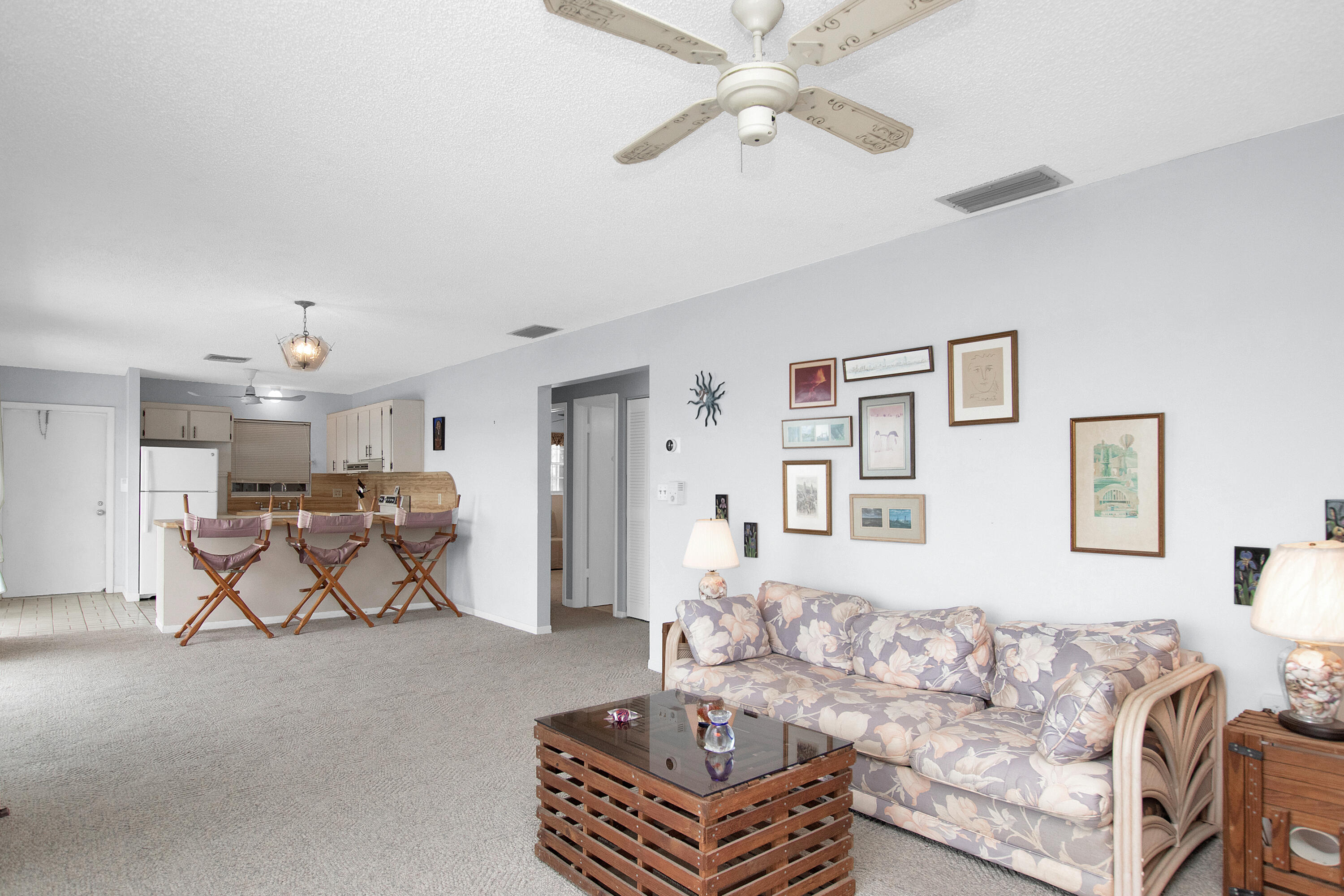 136 Brian Road Marathon, FL 33050 - Photo 7 of 19 a living room with furniture and a chandelier