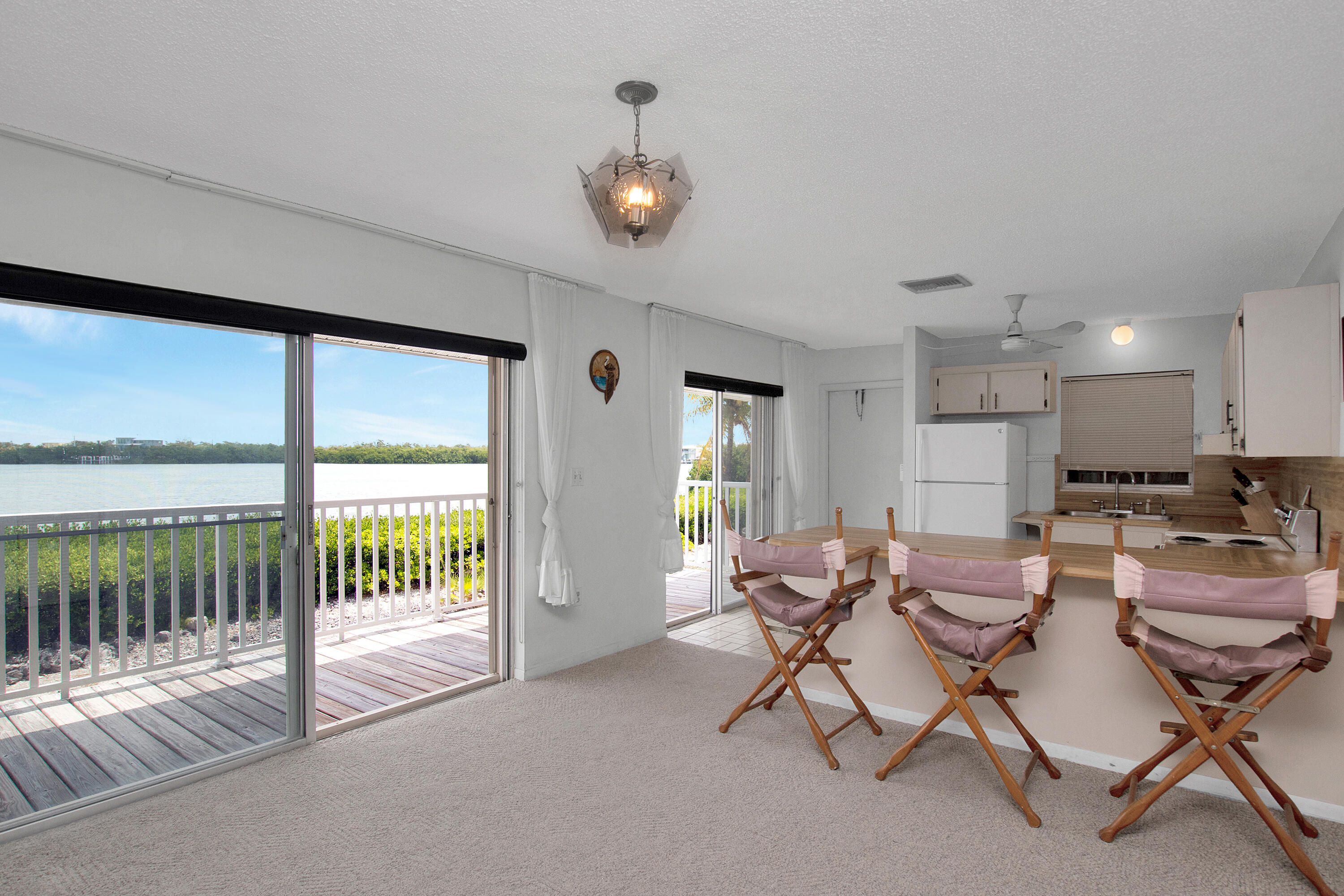 136 Brian Road Marathon, FL 33050 - Photo 10 of 19 a view of a dining room with furniture window and outside view