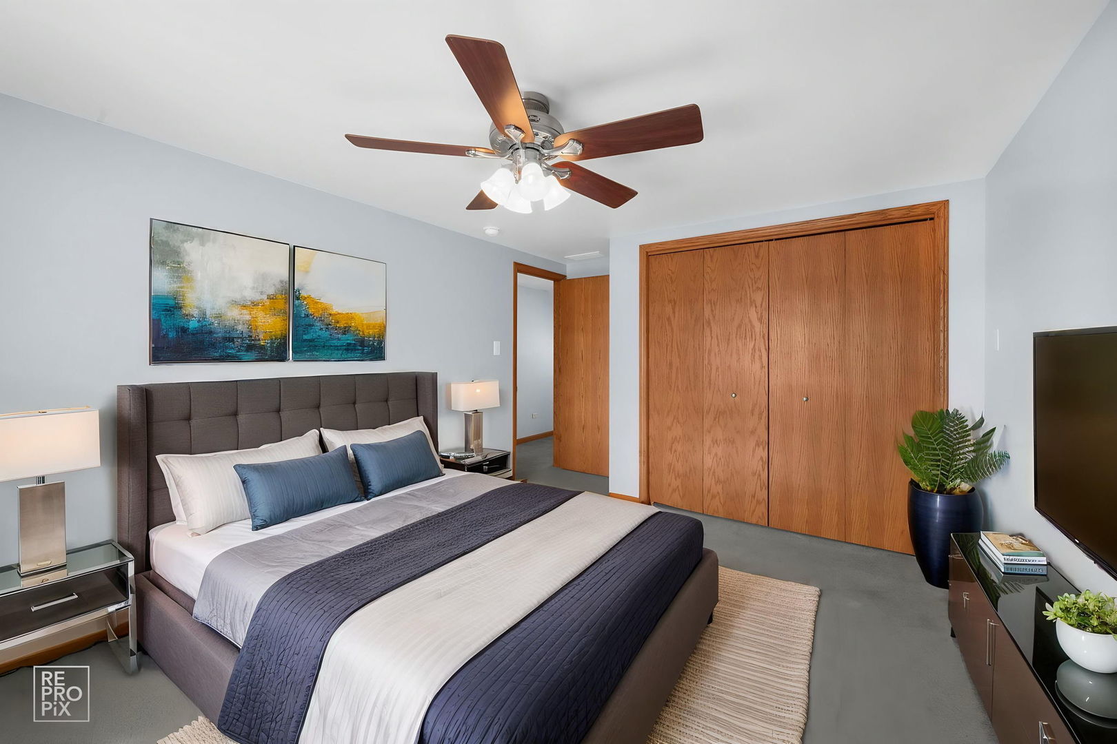 3235 192nd Street Lansing, IL 60438 - Photo 12 of 28 a bedroom with a bed and a painting on the wall